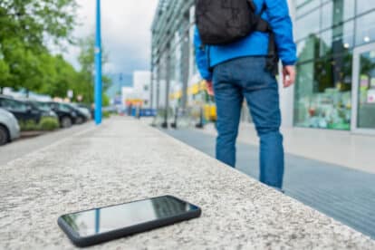 Close-up of cellphone lying on the bench forgotten by outgoing person