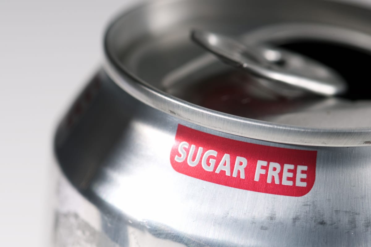 The phrase Sugar Free printed in red on a soft drink can.