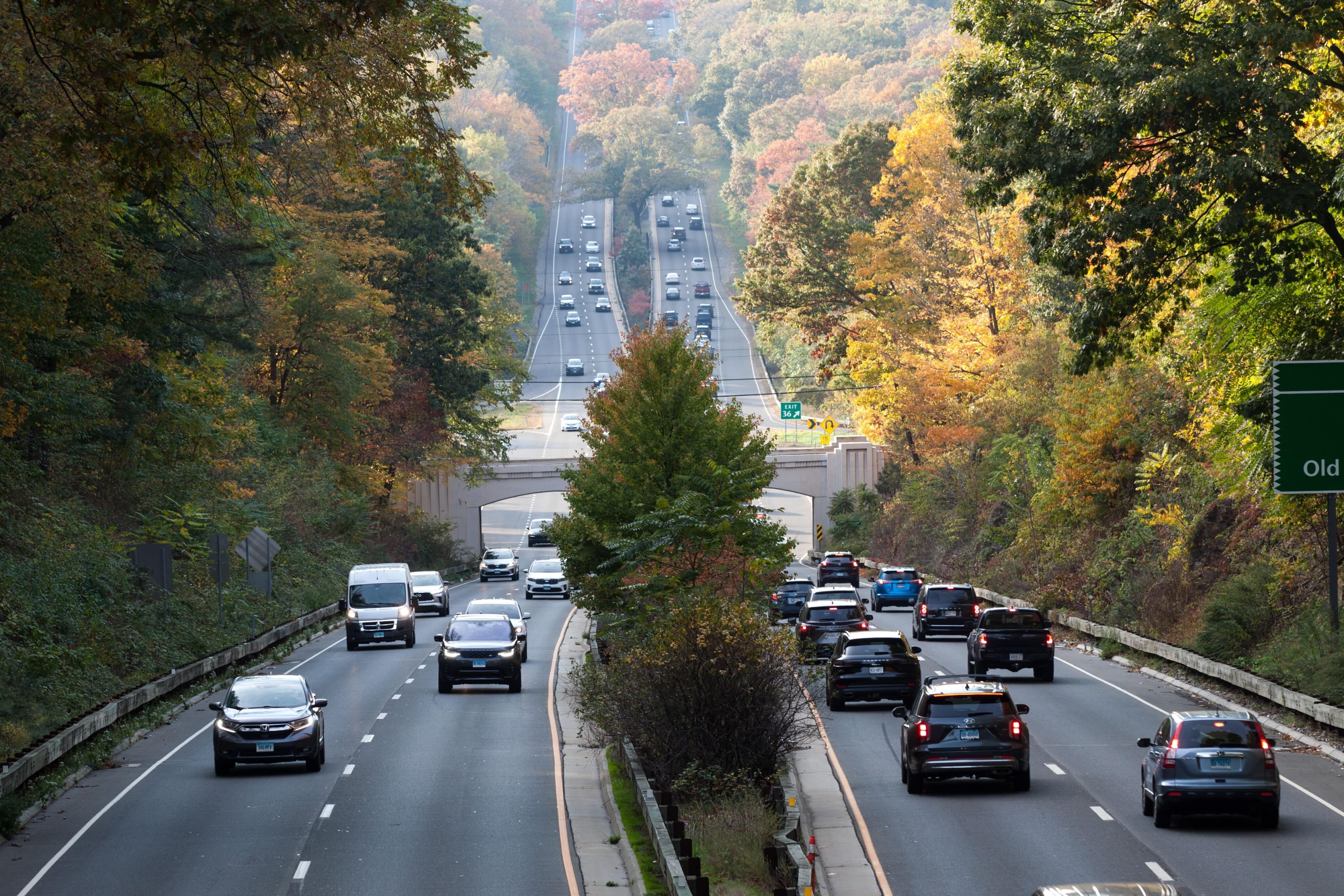 New Canaan, CT, USA - October 22, 2022: Daytime traffic on the interstate highway in New Canaan Connecticut.