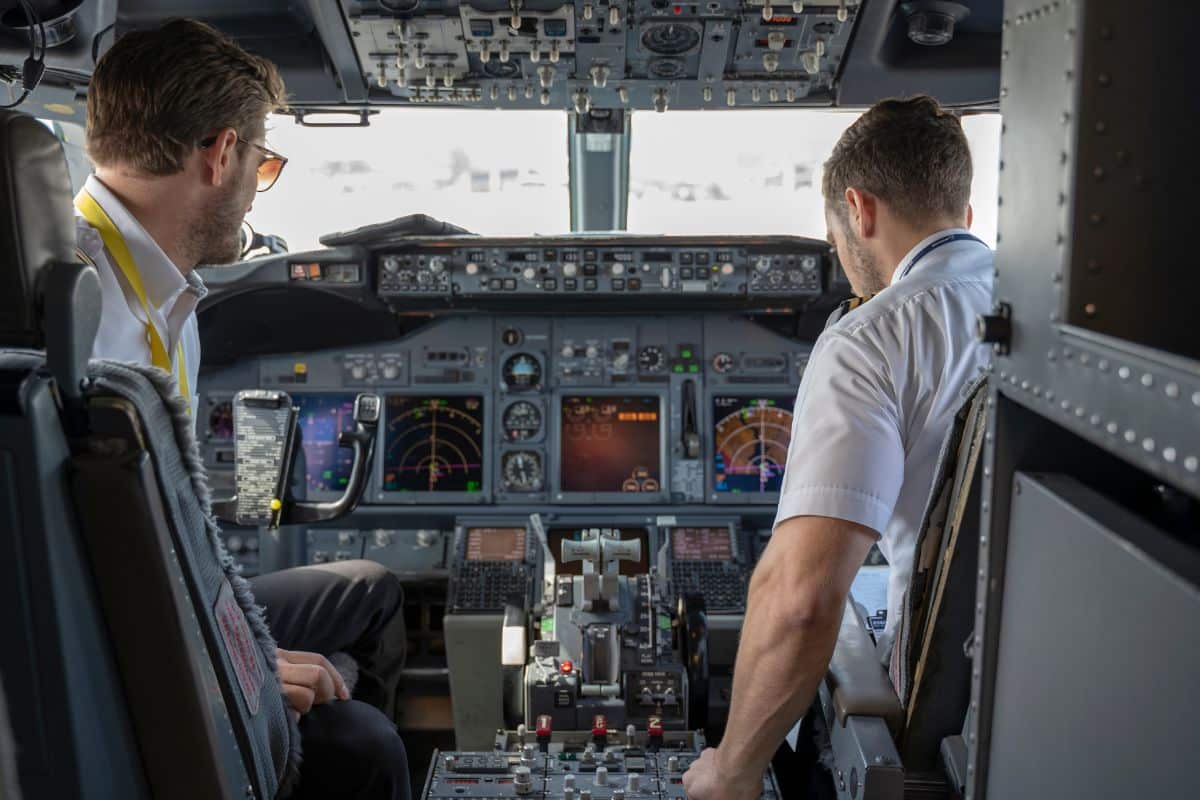Two pilots in cockpit. 