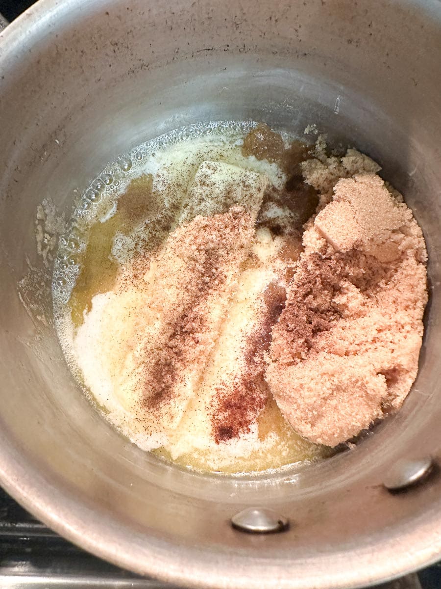 butter and brown sugar and allspice in small pot.