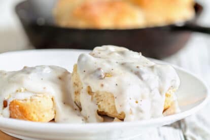 closeup of white gravy on biscuits. Shutterstock_1489274435Photo credit_ Stephanie Frey via shutterstock.