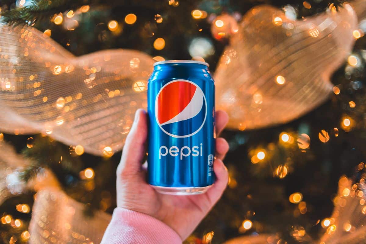 hand holding Pepsi can. 