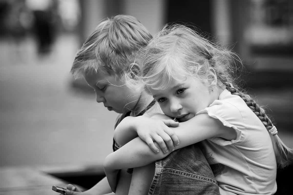 little girl hugging little boy. 