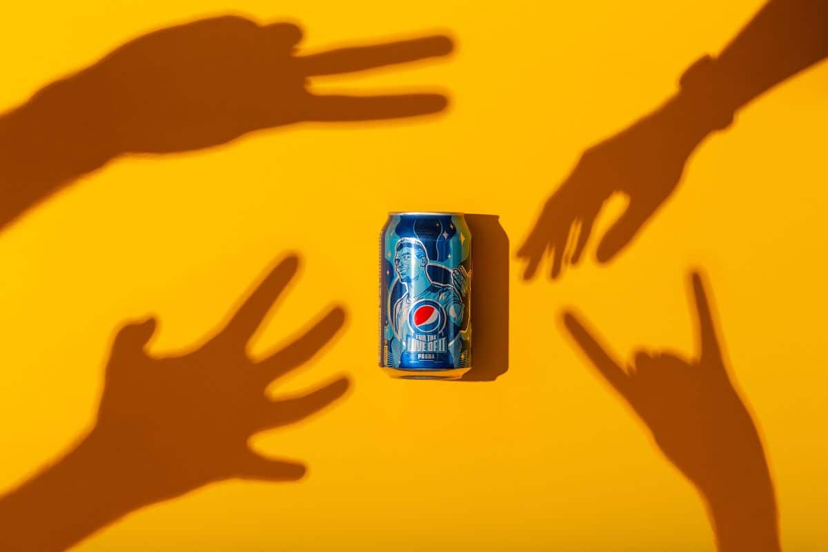 shadow hands reaching for soda. 