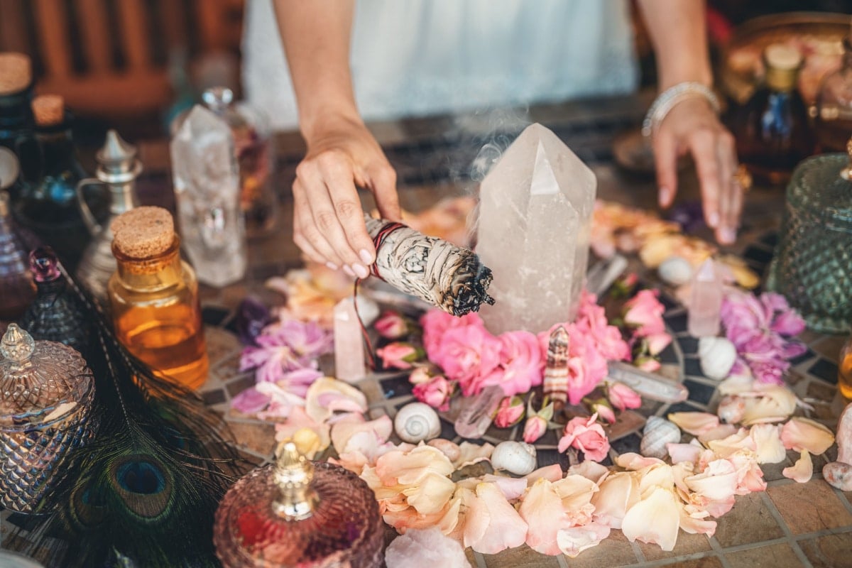 beautiful altar with crystals and rose flowers.