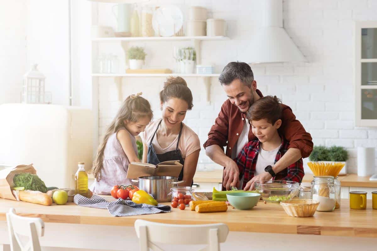 family cooking together. Shutterstock_1660483093.