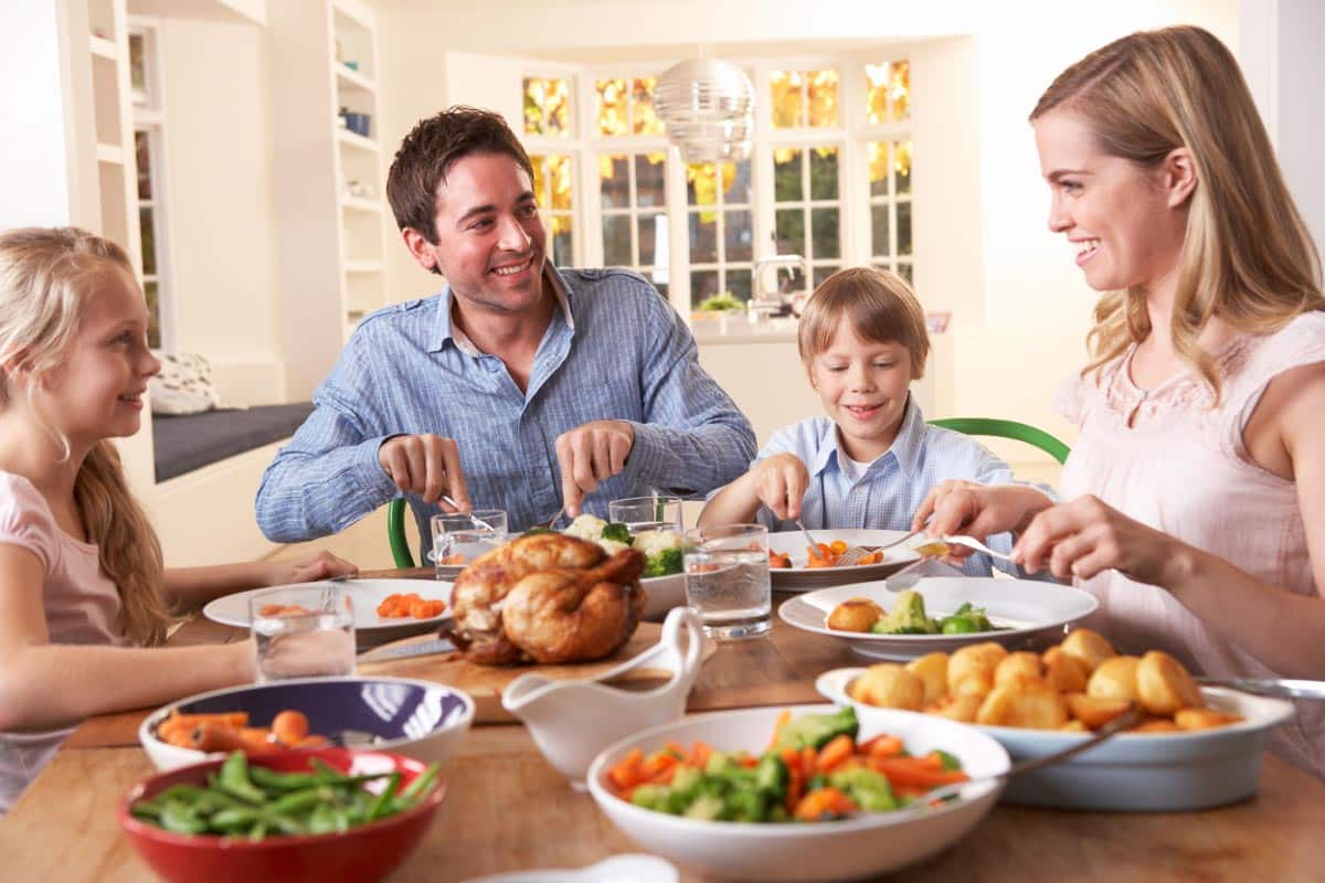 family eating dinner together. Shutterstock_70256782.