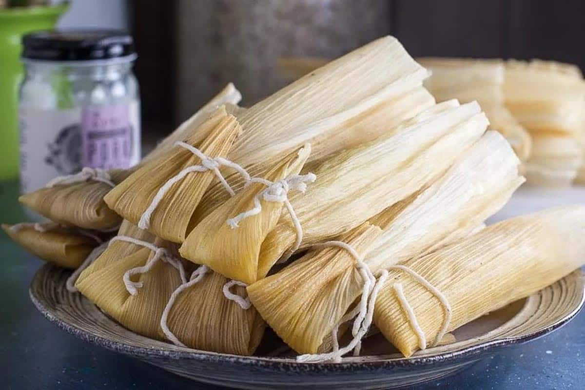 low FODMAP tamales stacked on plate.