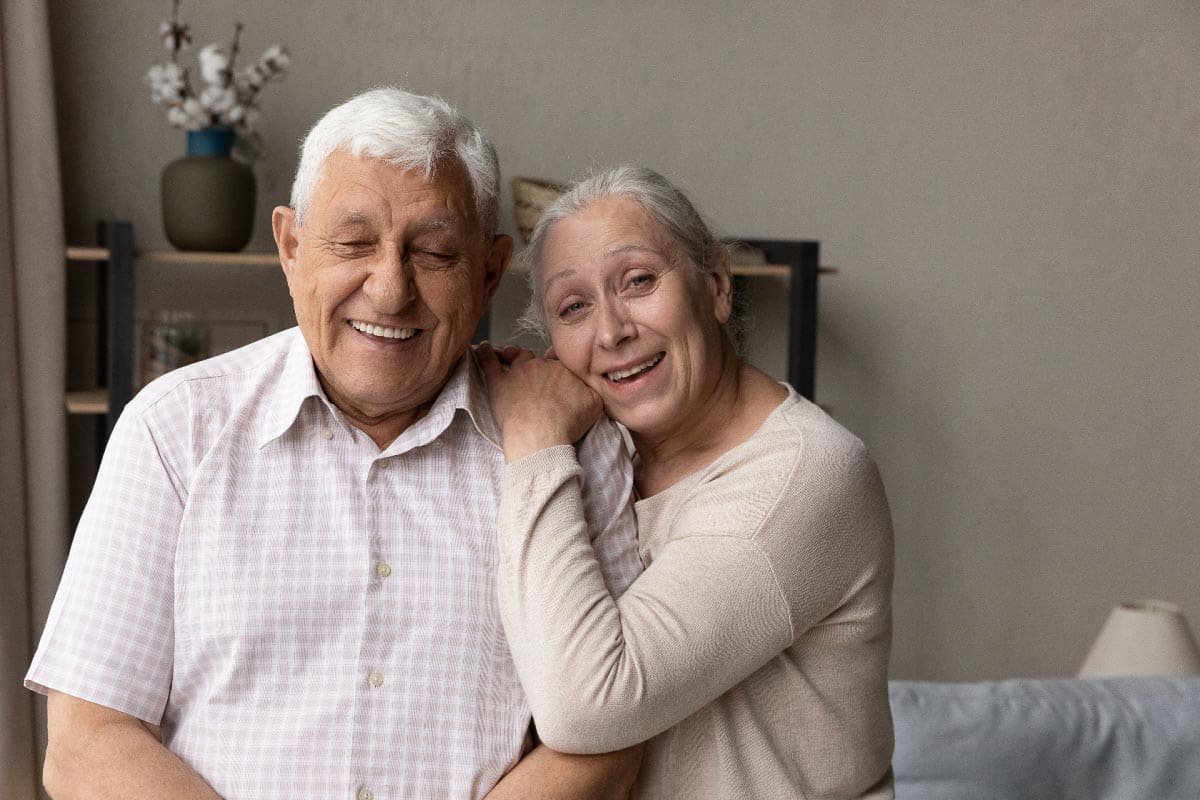 older couple on couch. Shutterstock_2103416816.