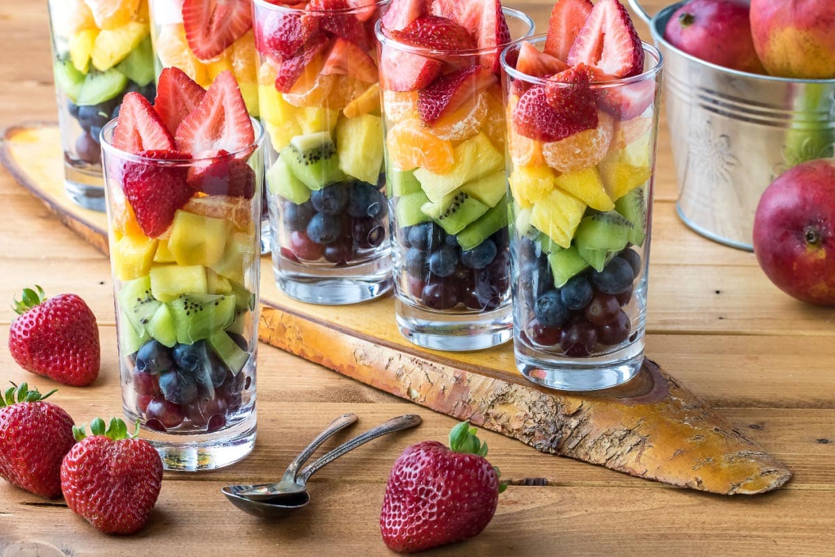 rainbow fruit salad in glasses. Shutterstock_1433848268.