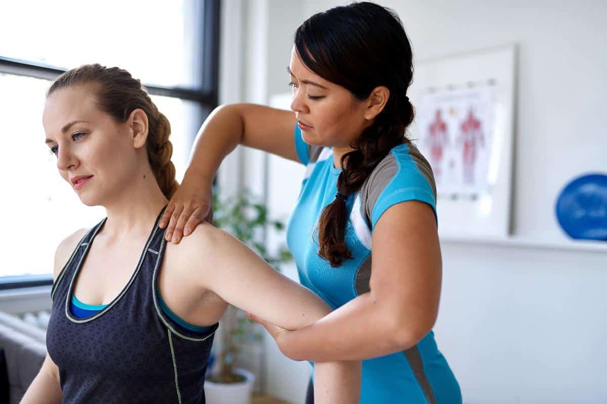 woman receiving physical therapy. Shutterstock_1550854181.