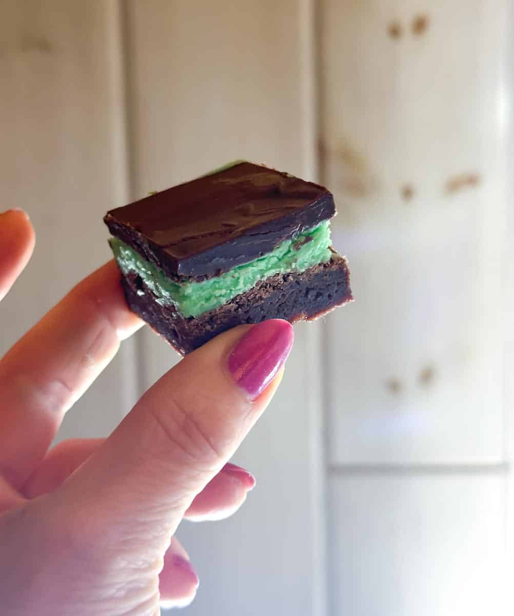 hand holding mint brownie.