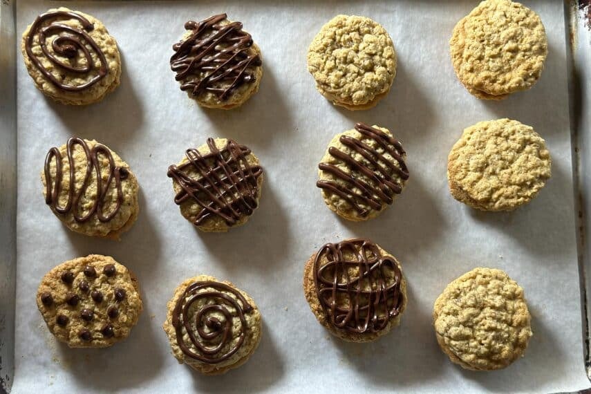 Low FODMAP Girl Scout Do-Si-Do Copycat cookies on tray, some with chocolate.