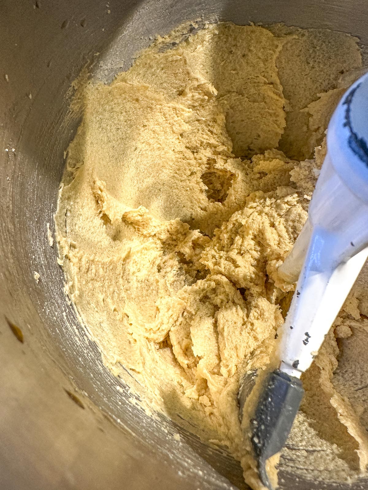 butter and sugar creamed in mixer bowl with egg.