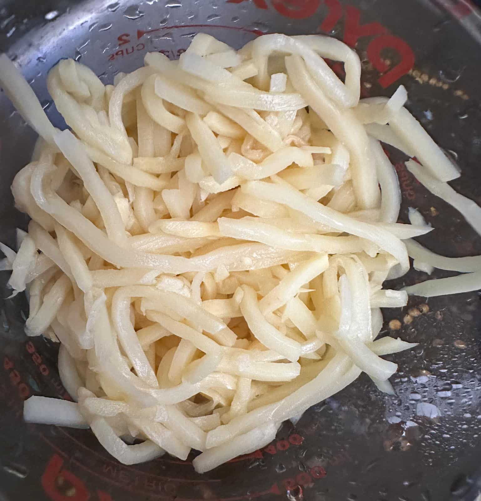 drained bamboo shoots in glass dish.