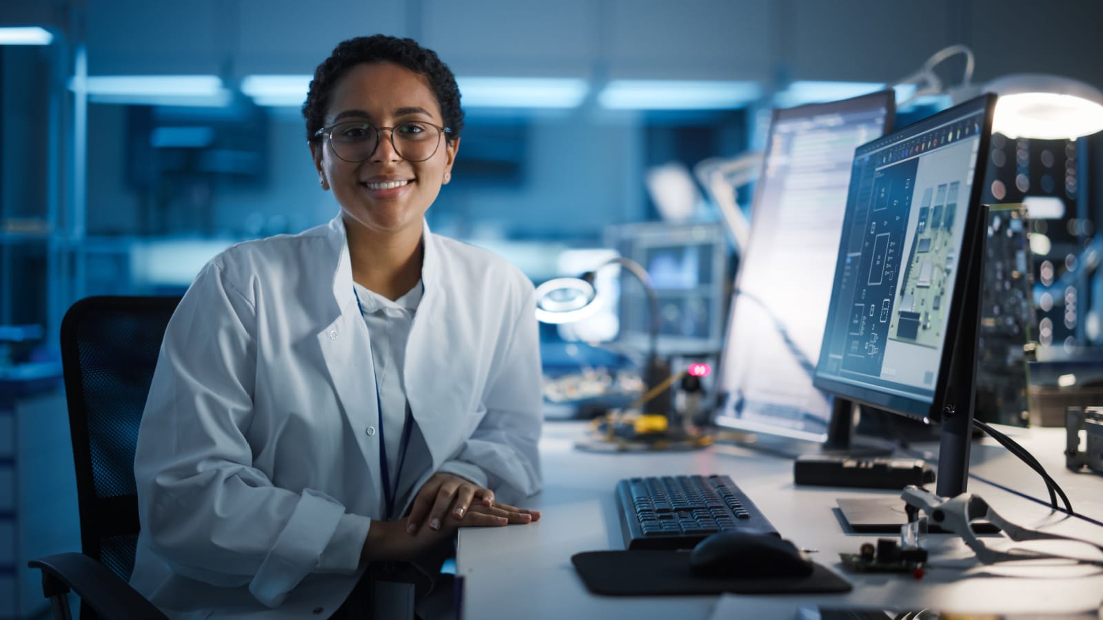 young female scientist in lab with computer.