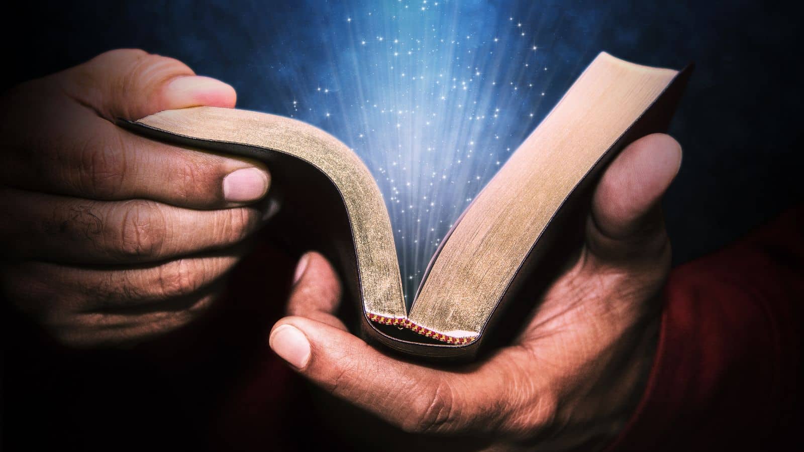 a bible in a man's hands