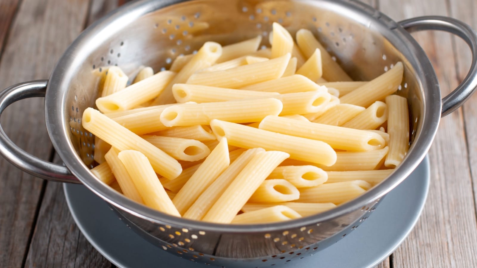Draining pasta in colander.