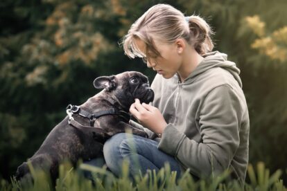 Woman speaking with dog.