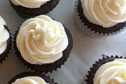 Low FODMAP American Buttercream Frosting on cupcakes closeup.