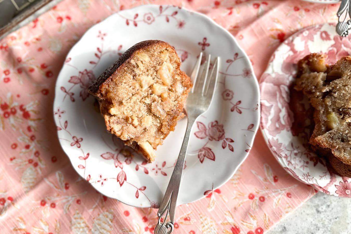 Low FODMAP Buttermilk Apple Nut Bundt Cake on plate with fork.
