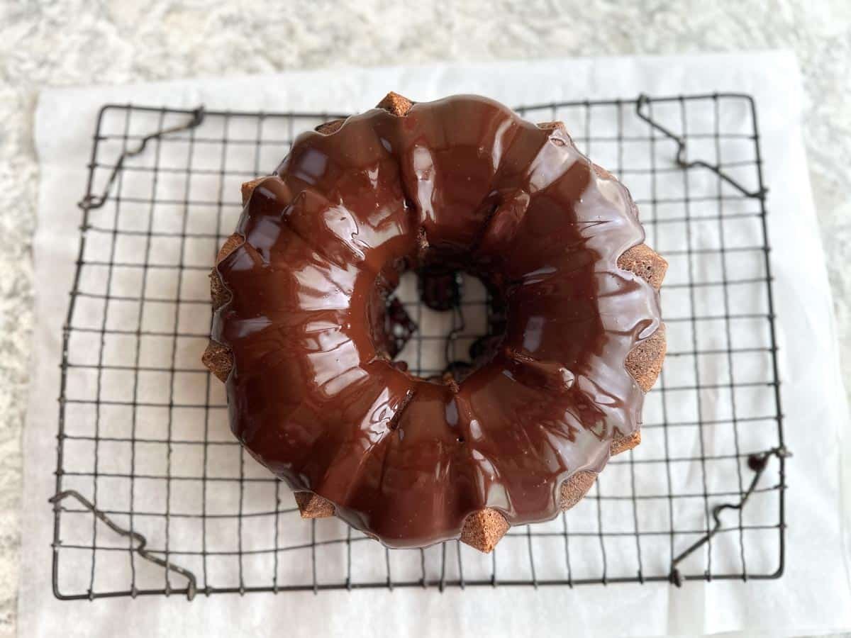 Low FODMAP Marble Bundt Cake on rack with glaze.
