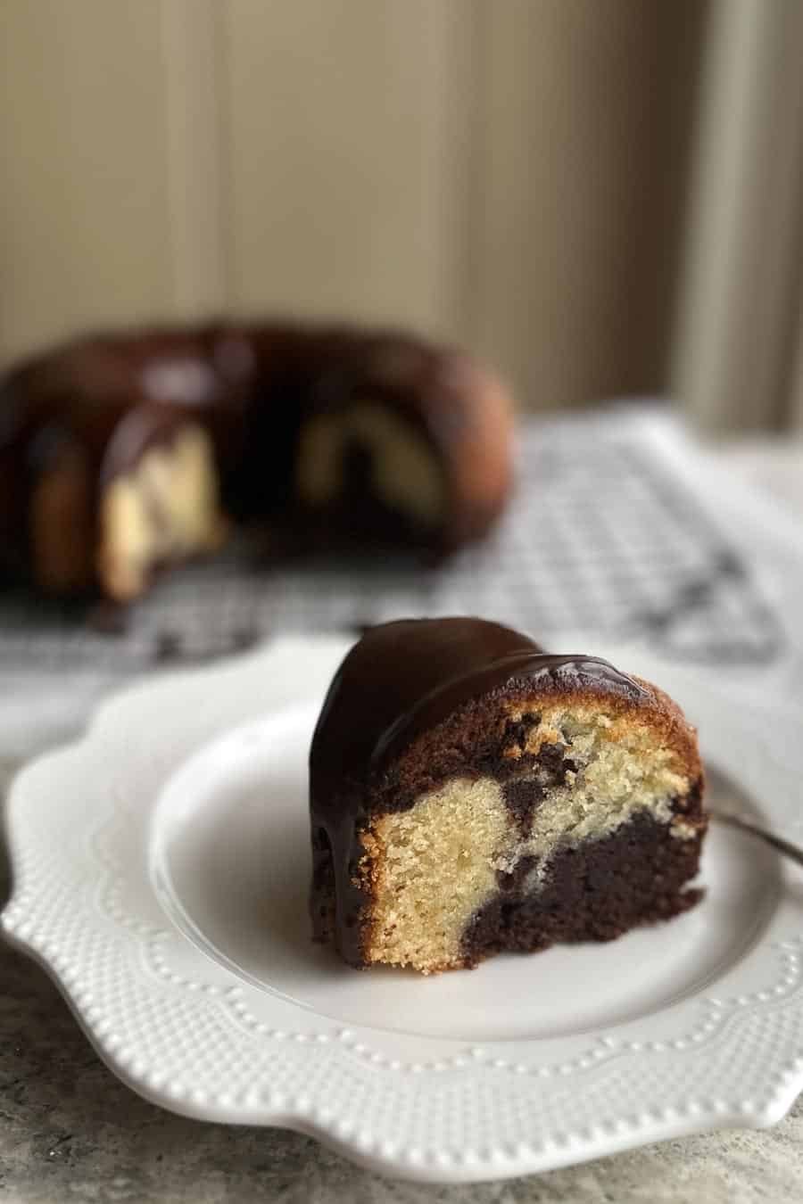 Low FODMAP Marble Bundt Cake slice on plate, vertical.