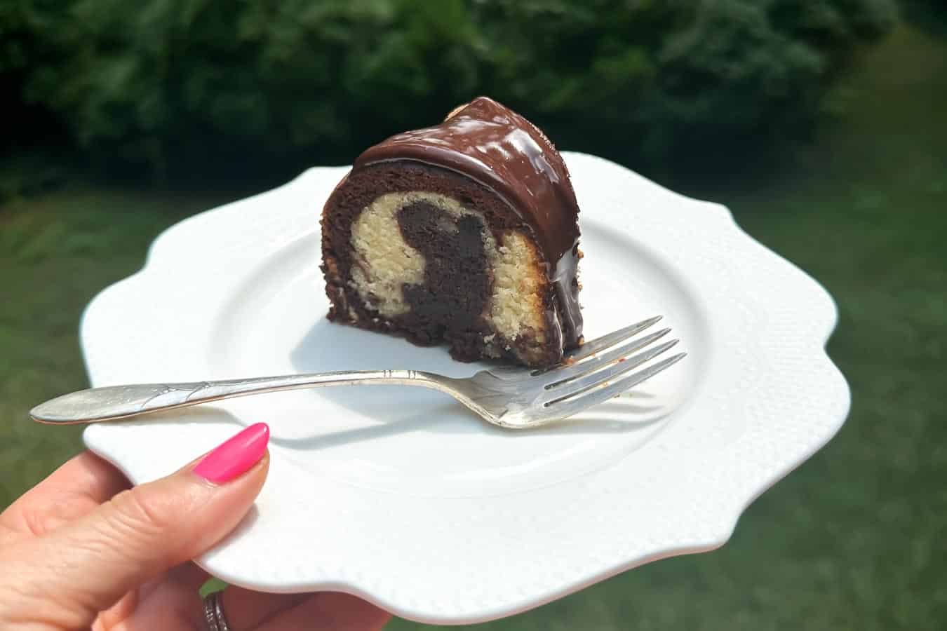 Low FODMAP marble Bundt Cake on plate with fork.