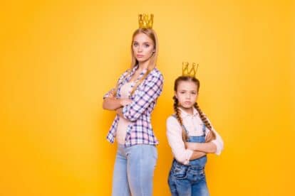 Older vs younger siblings! Who is parents best favorite blue-eyed girl?Bad behavior denim jeans outfit concept. Portrait of confident narcissistic beautiful girls isolated on bright background
