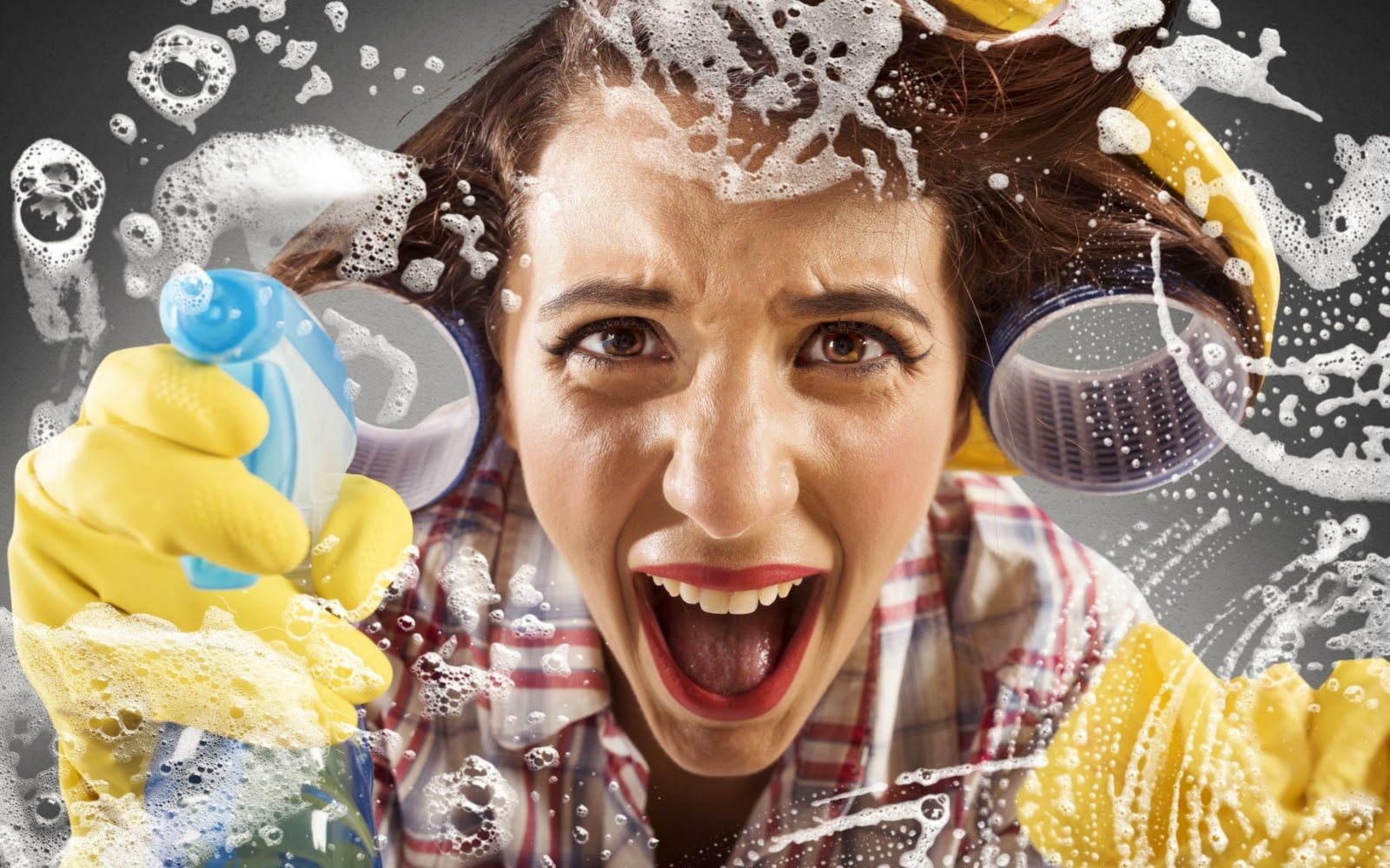 Desperate housewife screams while cleaning the glass