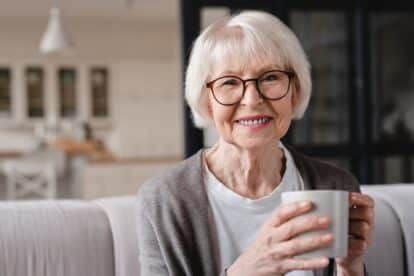 senior woman with a mug of coffee