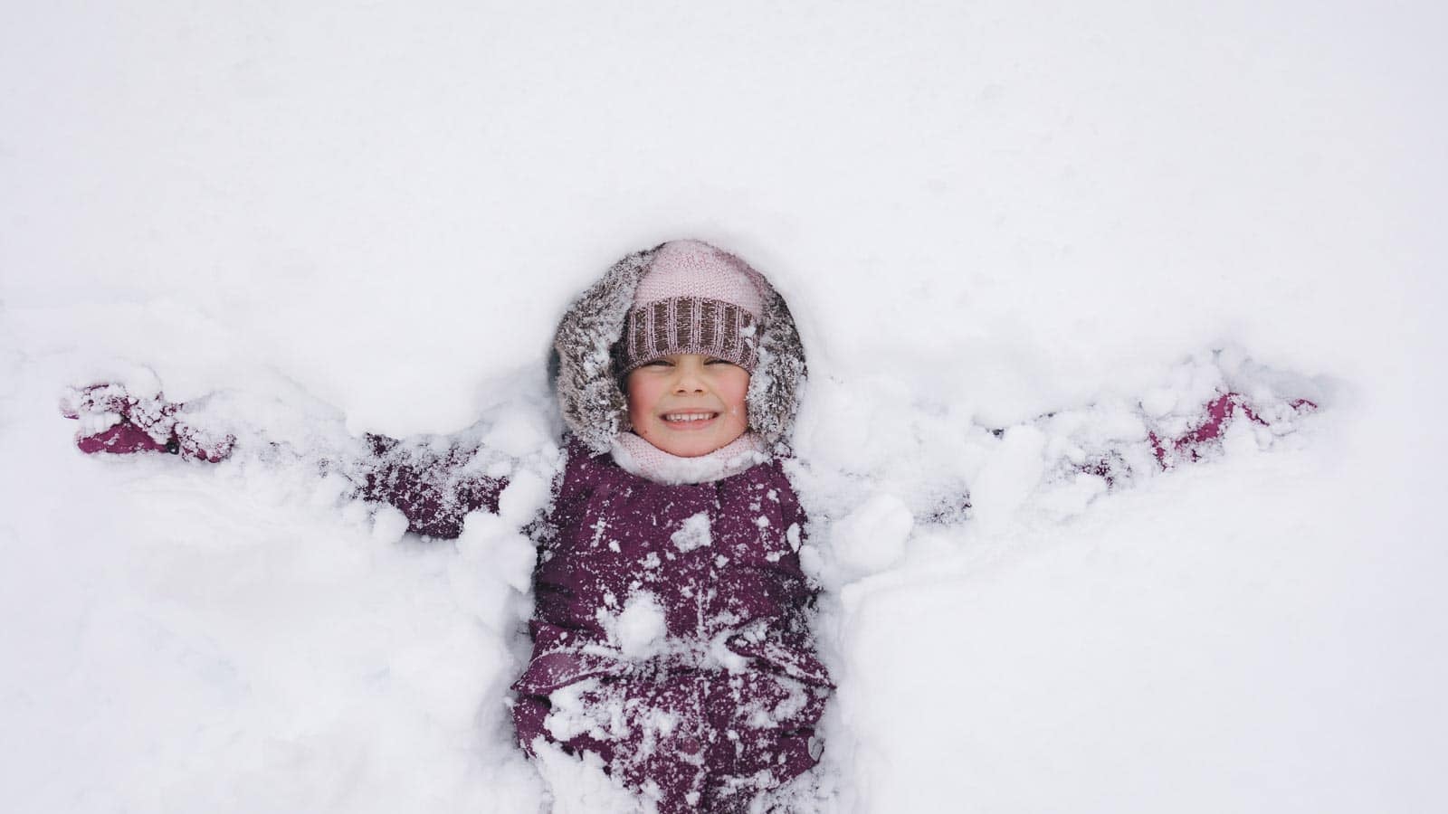 making snow angels. gritsiv via 123rf.