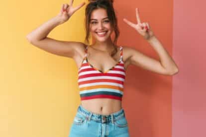 bare midriff top on happy young woman. antstang via 123rf