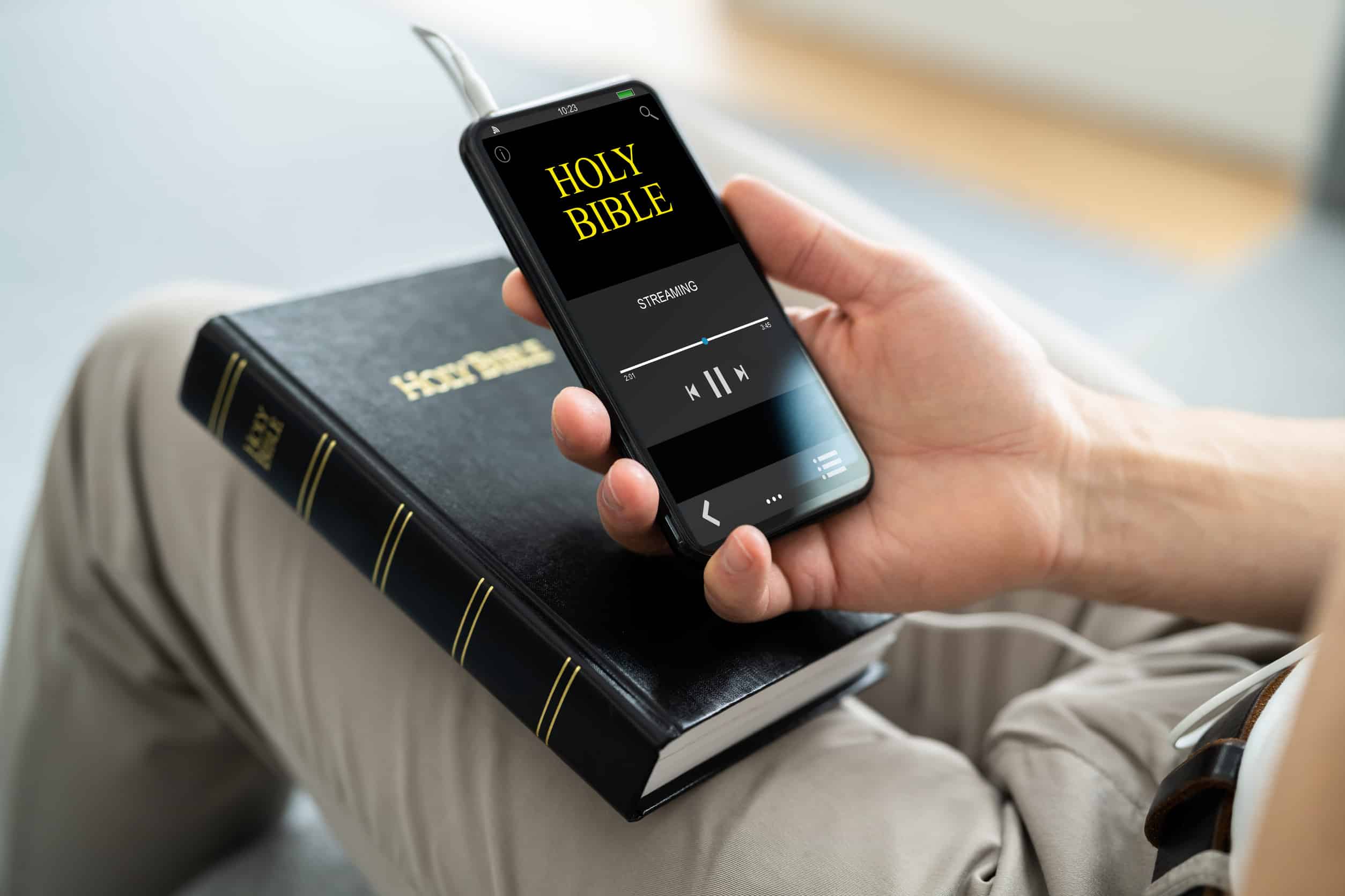Preacher Listening Bible On Phone. Praying With Headphones