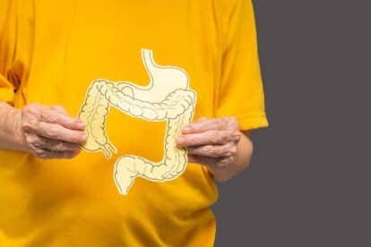 Woman holding image of colon. boon8studio via 123rf.