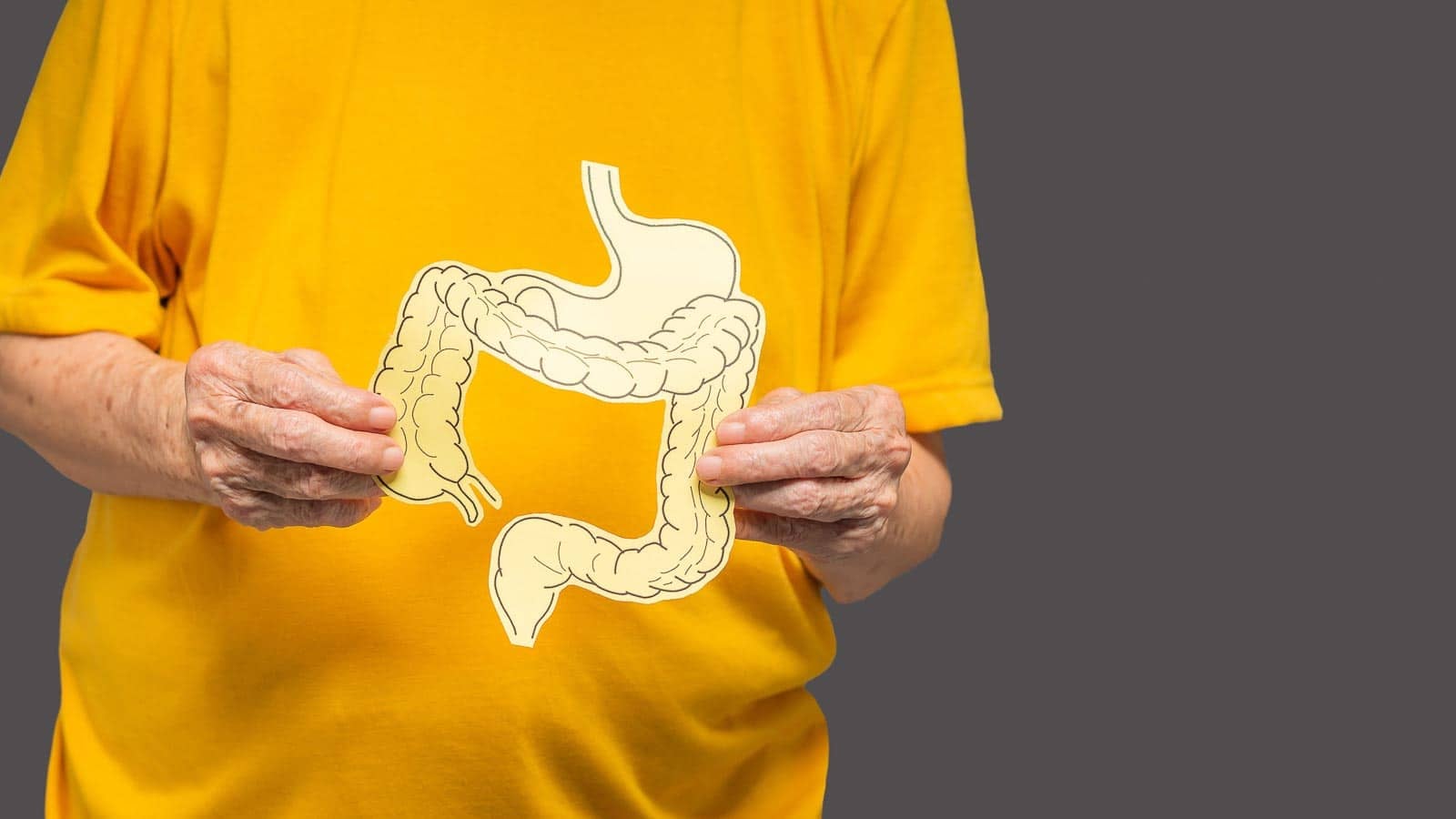 Woman holding image of colon. boon8studio via 123rf.
