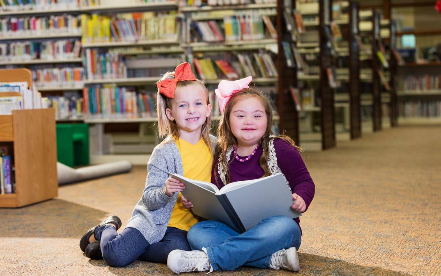 children in library. Image kali9 from Getty Images Signature via Canva.