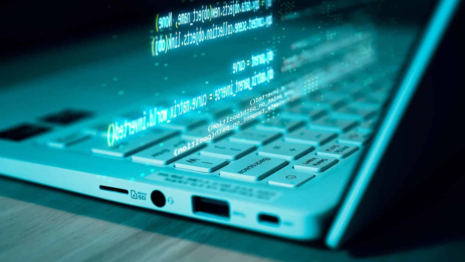 laptop being hacked. Code. meshcube via 123rf