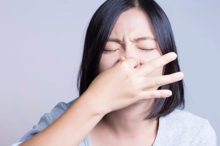 Holding nose. Smelly. Fart. Gas. chajamp via 123rf