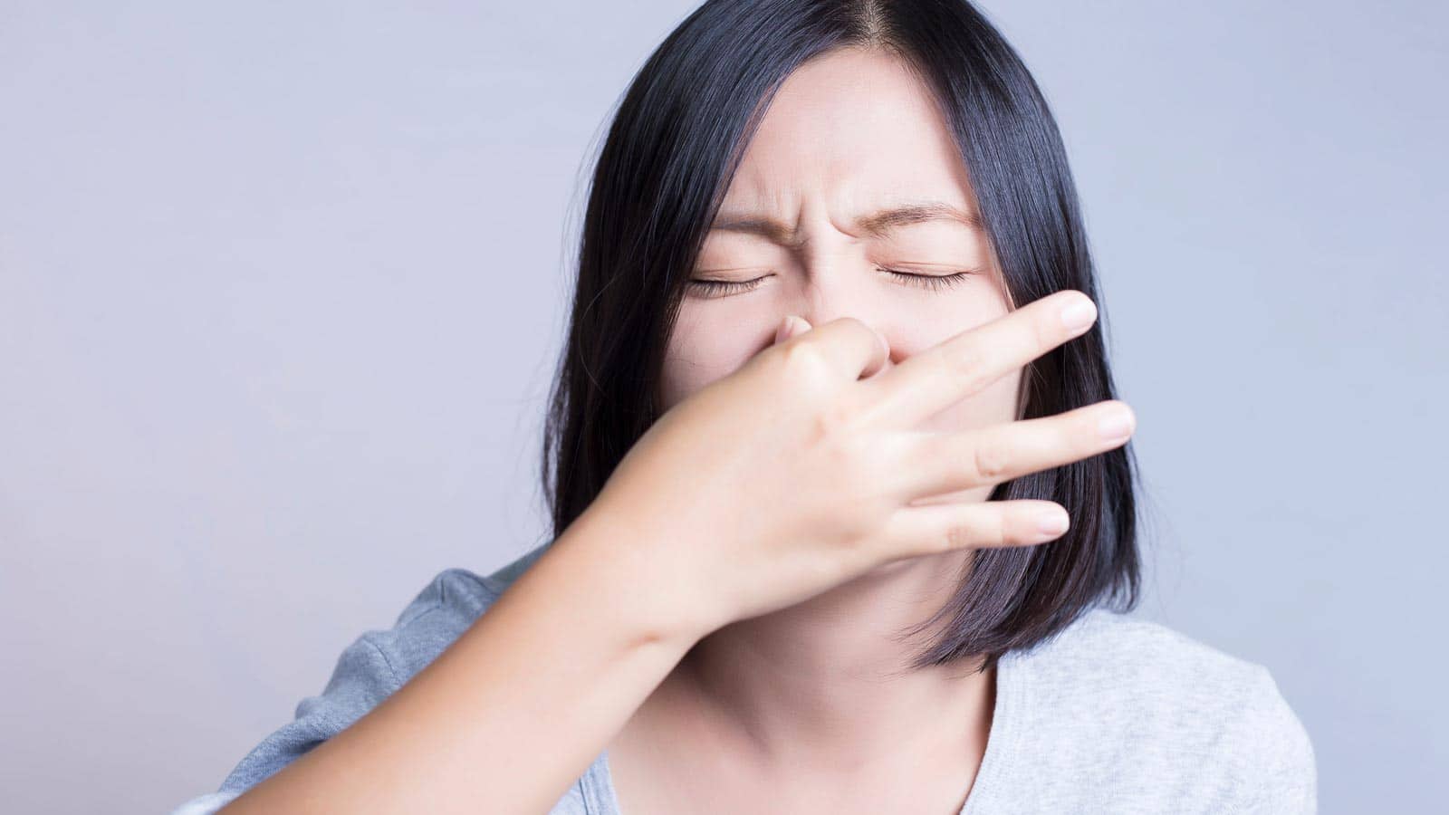 Holding nose. Smelly. Fart. Gas. chajamp via 123rf