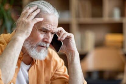 Unhappy,Senior,Man,Having,Phone,Conversation,With,Someone,,Touching,His