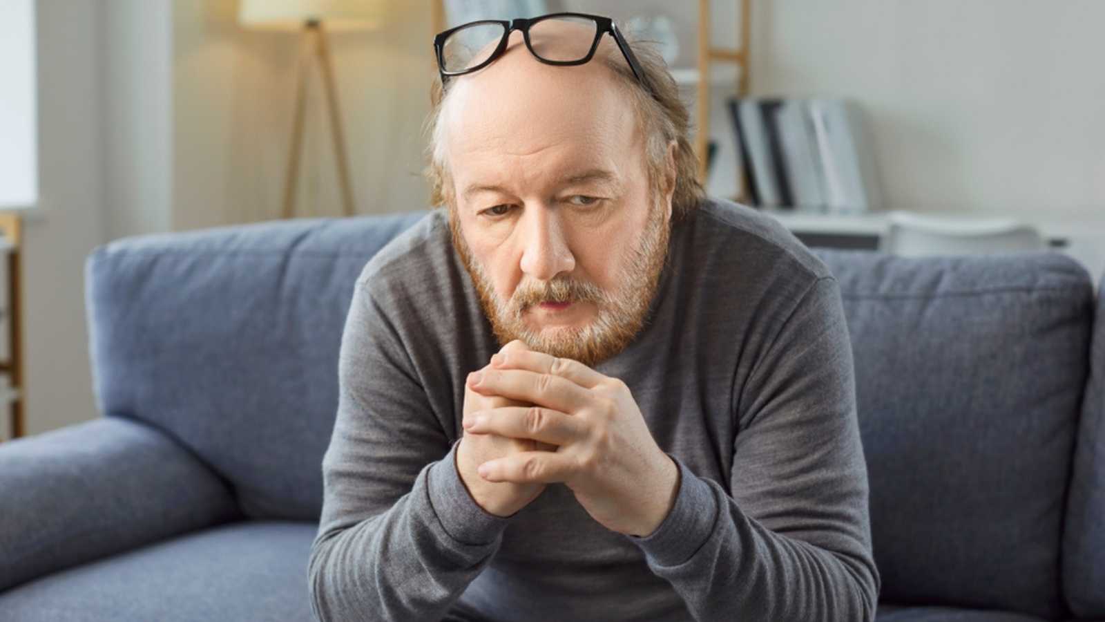 Sad thoughtful bored older man alone looking feeling depressed, frustrated, lonely, suffering form memory loss, dementia, Alzheimer disease, mental disorder, having old age problem, missing family