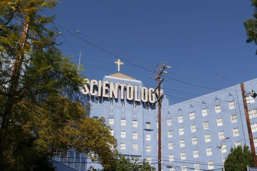 Los Angeles, California USA - 24 Feb 2020: Church of Scientology exterior, facade of blue building near American Saint Hill Organization in Hollywood. Logo and cross. International religious movement.