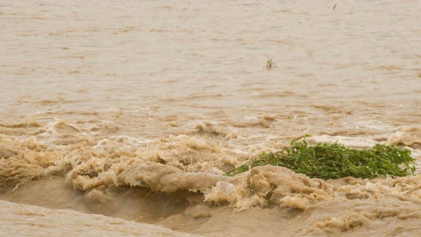 Rushing flood water swirls after heavy rains in Indiana