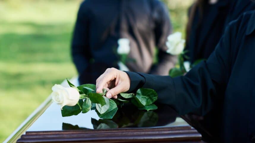 Hand of mature woman in mourning attire