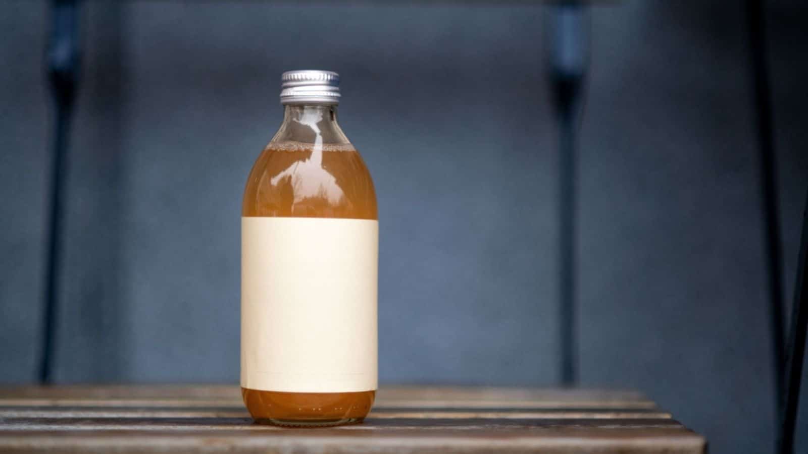 Glass bottle with kombucha.