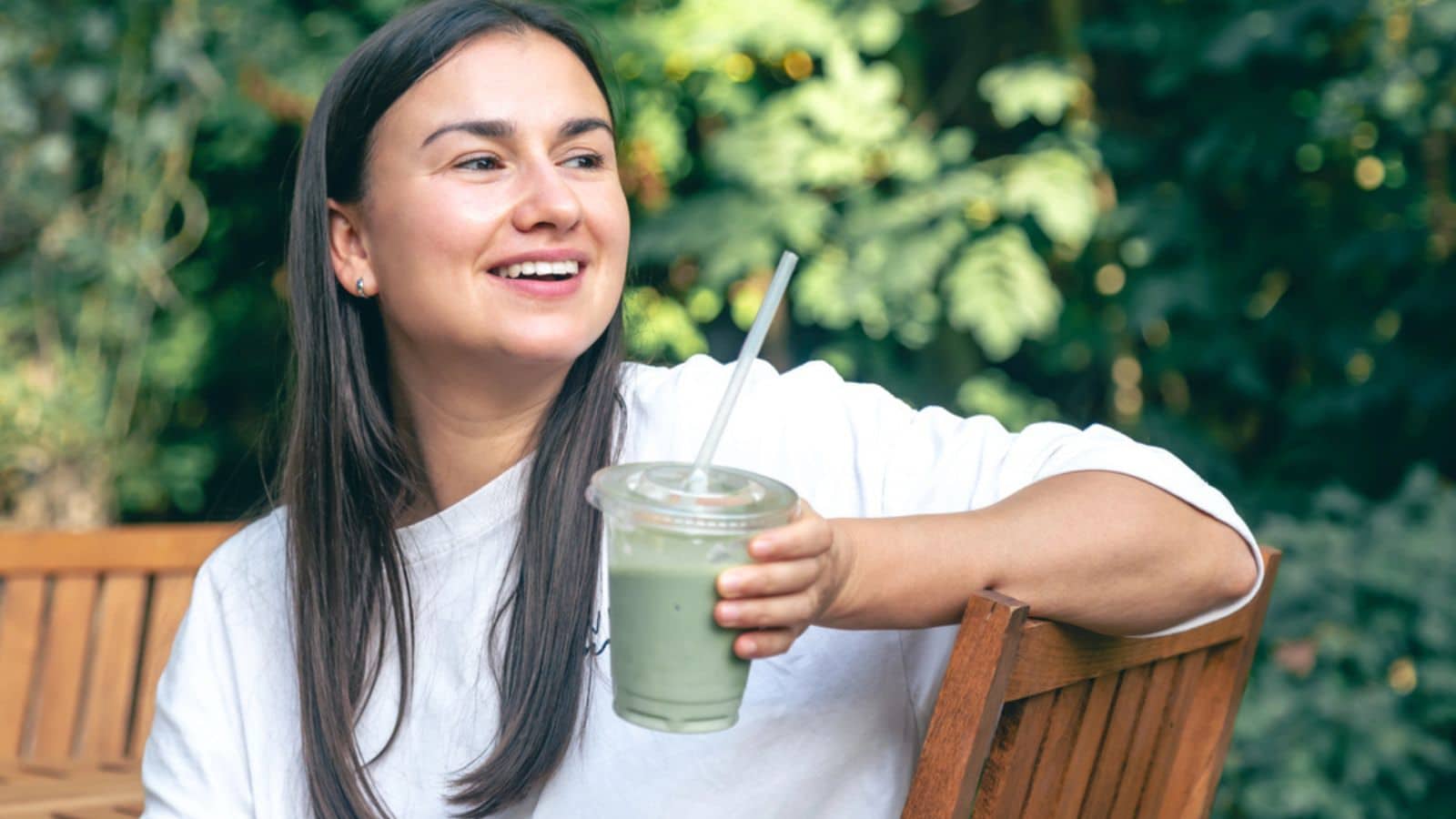 Woman drinking matcha latte