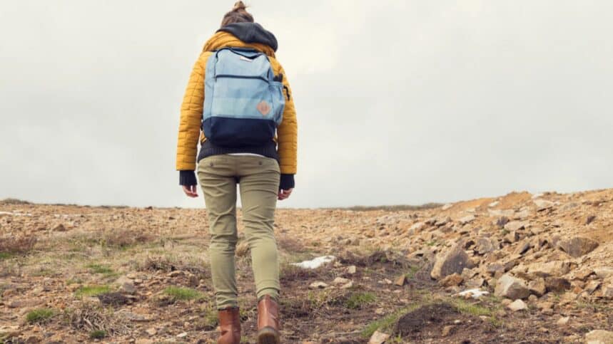 woman walking up a hill