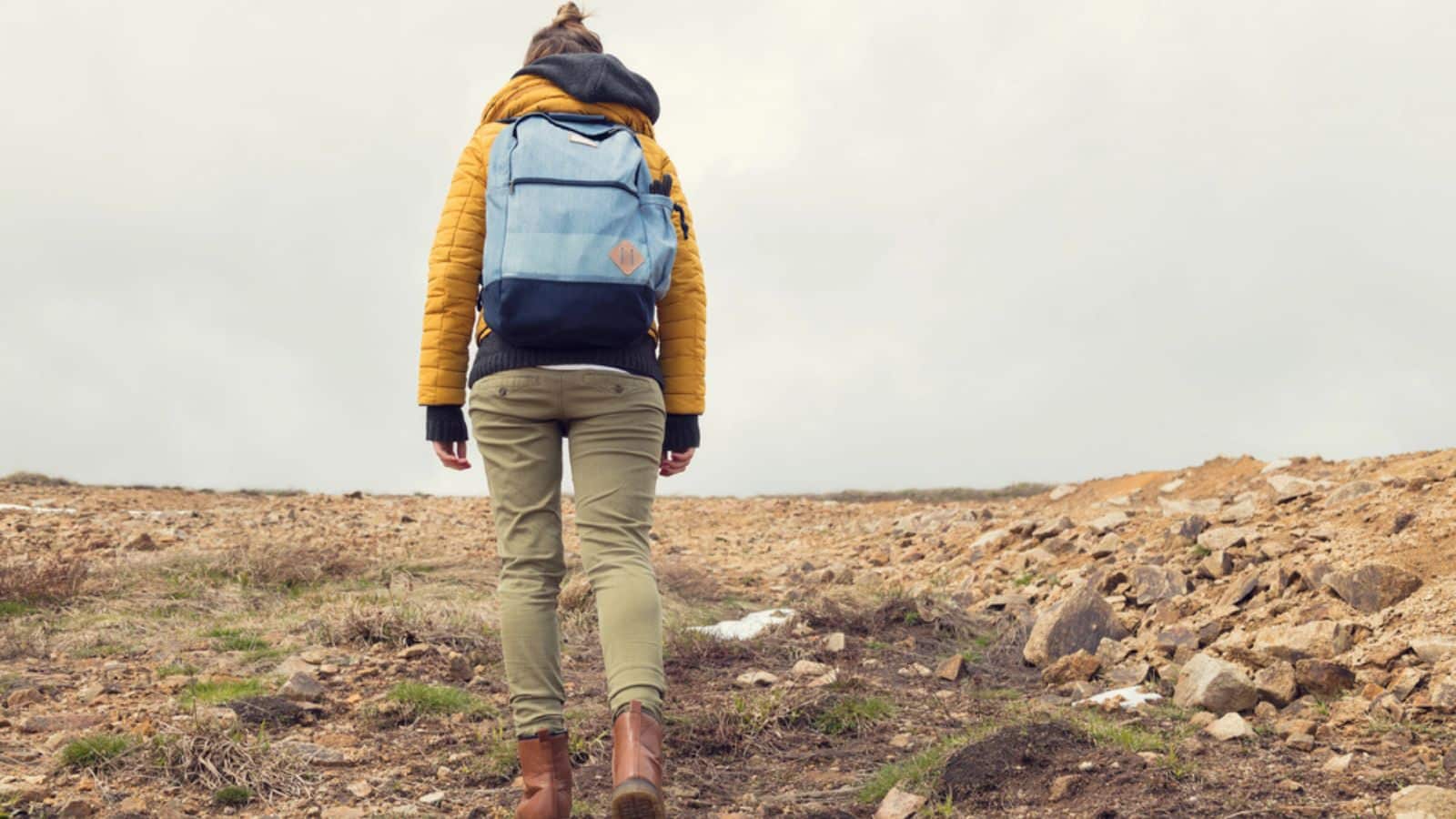 woman walking up a hill